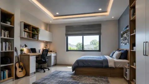 Kamar remaja dengan meja belajar di bawah plafon sederhana
