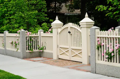 Elegant gate and fence on house entrance